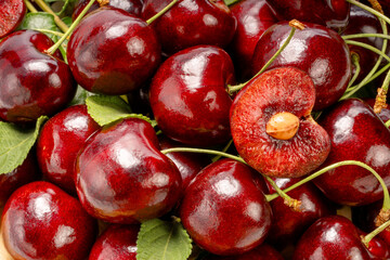 Close up shot Red Cherry in basket on wooden background.