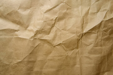 crinkled brown paper texture with a complex pattern of folds and creases.
