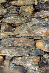 texture of old stone wall made in the 17th century, in Ouro Preto, Brazil.