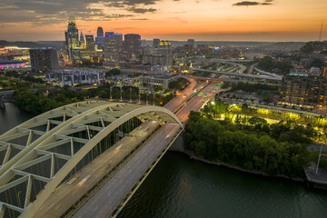Daniel Carter Bridge in Cincinnati city, Ohio, USA with highway traffic driving cars in downtown...