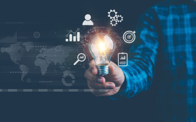 businessman holding light blub with virtual Global Internet connection. global internet connection application technology and digital marketing, Financial and banking, Digital link tech, big data.