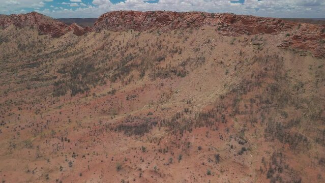 An aerial view of the rugged mountain ranges of the MacDonnell Ranges situated in the Northern Territory, Australia