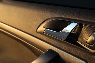 Closeup view of car door with handle