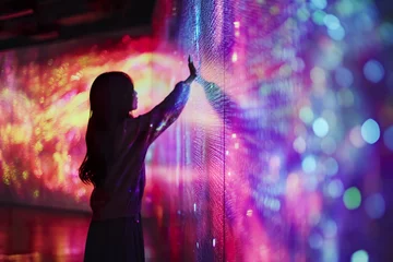 Poster Mur Woman experiences contact with technology, digital wall of LED lights.