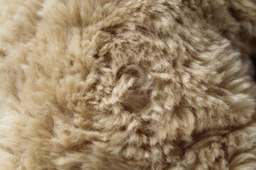 Close up textured background of soft brown plush fabric material
