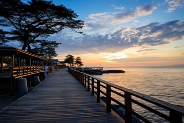 Fototapeta premium Sunset Pier, A Long Wooden Path to the Ocean