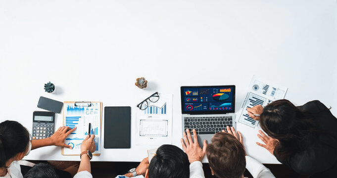 Group of office worker and businesspeople working on business financial data analysis. Empty space with editable blank background meeting table for customer design. Prudent
