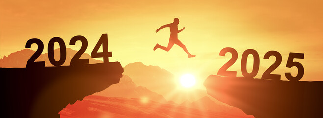 Man jumping on cliff 2025. Silhouette man jumping between cliff with number 2024 to 2025 on sunset...
