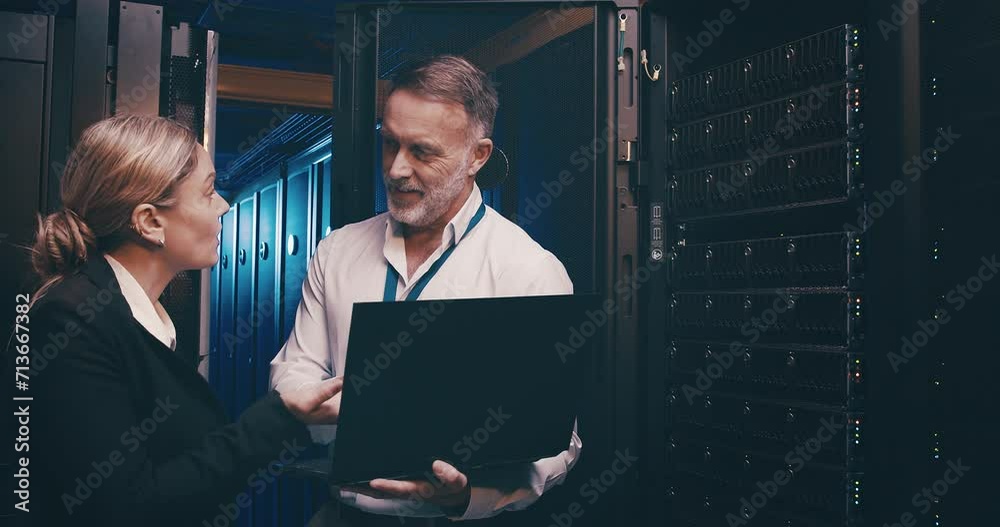 Poster Server room, man and woman with laptop with communication, information technology and discussion. Datacenter, employees and teamwork with talking to store and power computer hardware on the system