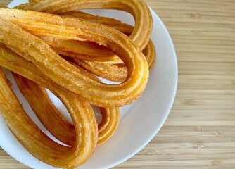 Traditional Spanish churros on a plate