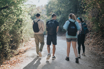 Friends Exploring the Autumn Wilderness on a Sunny Day, Enjoying Physical Activity and Fun Conversations Amidst the Fresh Air and Green Environment.