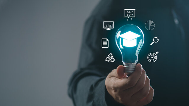 man holding lightbulb showing graduation hat, Internet education course degree, study knowledge to creative thinking idea and problem solving solution. E-learning graduate certificate program concept.