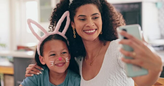 Mother, child and easter in selfie, smile and bunny ears for festive holiday, face paint or post in family home. Mom, kid and rabbit costume with celebration, photography and memory on social network