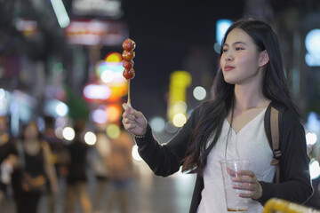 asian woman traveller backpack. Happy young tourist woman on street. Young woman at Bangkok...