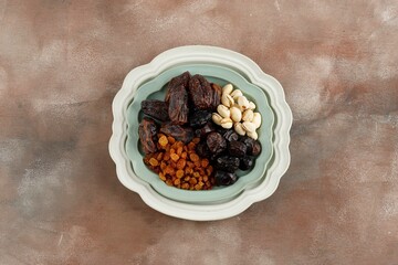 Various Snack for Sweet Takjil Iftar Moslem Ramadan Month, Pistachio, Dates Fruit, and Golden Raisin.