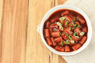 Stir Fry Spicy Rice Cakes Tteokbokki or Korean Topokki Topped with Sesame Seeds and Green Onion