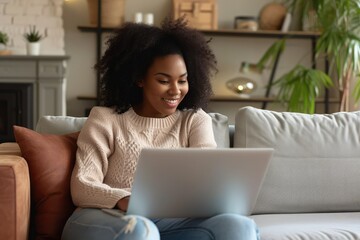 Comfortable mixed race woman in video conference, lounging on sofa, home laptop use