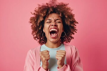 Ecstatic black woman yelling in victory, isolated pink backdrop - obrazy, fototapety, plakaty