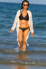 Woman body pretty with black  bikini on beach