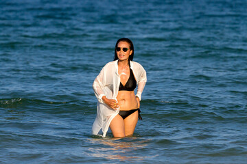 Woman body pretty with black  bikini on beach