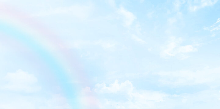 Rainbow on blue sky with Clouds painted on canvas. Picturesque view of beautiful rainbow and blue sky on sunny day