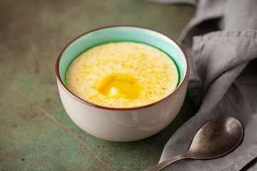 Corn porridge with butter. Healthy baby food