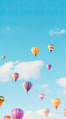 Vibrant hot air balloons floating in a clear sky wallpaper for the phone