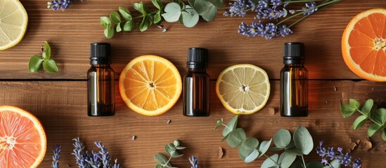 Aromatherapy Essential Oils with Citrus Fruits on Wooden Table - obrazy, fototapety, plakaty