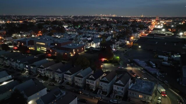 Drone shot of the houses in a residential neighborhood in Clifton city at night in New Jersey, USA