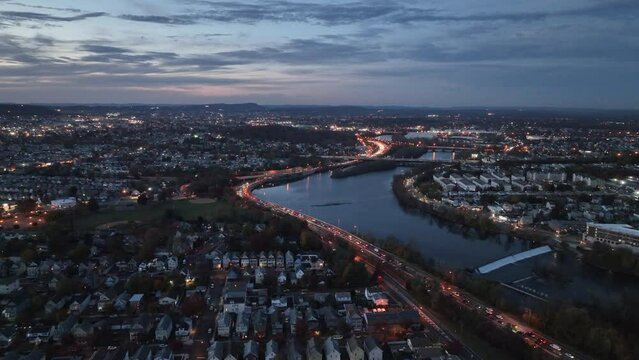 Aerial view of residential neighborhoods and Passaic River in Clifton city at sunset in New Jersey