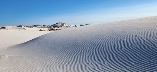 A scenic landscape view of White Sands National Park in New Mexico.