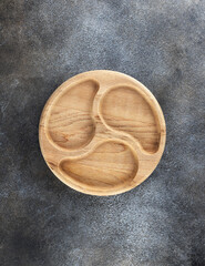 Empty round wooden board. Wooden utensils or plate for serving snacks. Top view