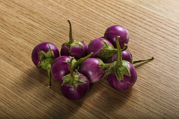 Raw small purple asian baby eggplant