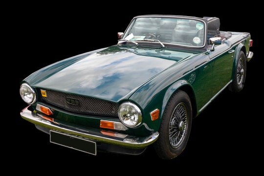 Triumph TR6 sports car isolated on black background