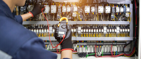 Electricity and electrical safety maintenance service system, Technician hand checking electric...