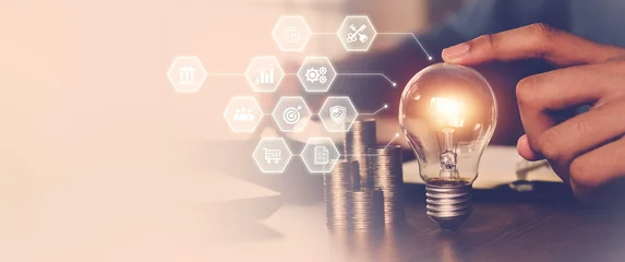 Foto op Canvas Hand choose light bulb with bright and icons for creative idea concept or innovation of technology in analyzing global marketing online business data management services to target growth concept. © Eakrin