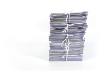Pile or heap of paper financial business document paperwork stack on office desk concept of...