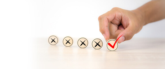 Hand choose check mark on cross symbol for true or false changing mindset or way of adapting to...