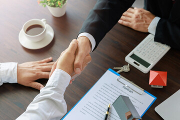 Estate agent shaking hands with customer after contract signature, Business Signing a Contract Buy - sell house, Home for rent concept. - obrazy, fototapety, plakaty