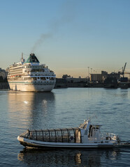 Early morning sunrise arrival of classic German cruiseship cruise ship liner into Montréal port,...
