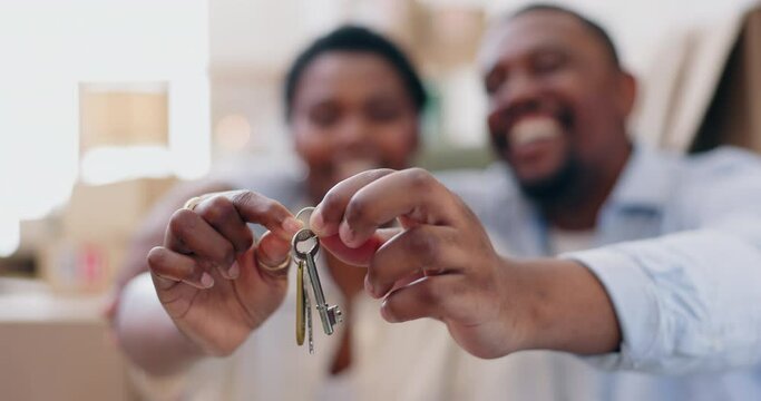 New house, couple and hands with keys, happy and closeup for achievement, mortgage or investment. African man, black woman and excited with box for fresh start with real estate, property or apartment