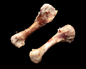 Chicken bone isolated on black background. Close-up