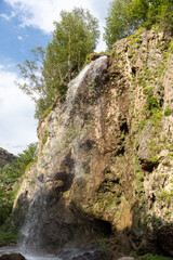 Waterfall on a rocky river in the mountains
