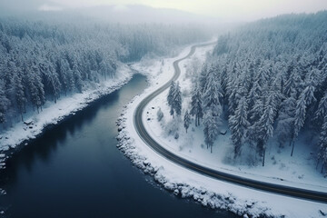 Asphalt road in snow near lake in winter season