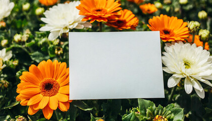 Blank paper sheet card with mockup copy space on orange and white flowers