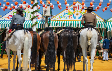 beautiful horses with their riders at the Feria de Abril in Seville,Andalusia,Spain - obrazy, fototapety, plakaty