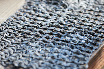 Fragment of the chain mail of a medieval knight close-up