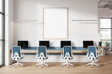 White and blue coworking office with poster