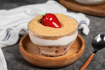 Strawberry magnolia dessert. Magnolia dessert in bowl on dark background. Close up