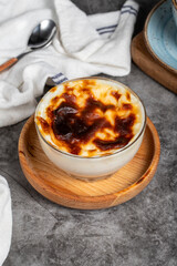 Rice pudding dessert. Rice pudding in bowl on dark background